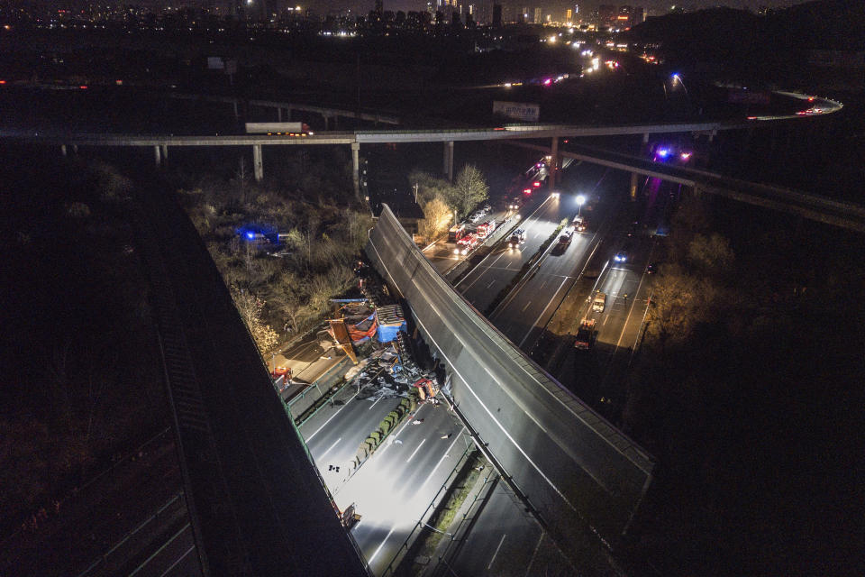 This aerial photo released by Xinhua News Agency shows a ramp bridge collapsed in Ezhou, central China's Hubei Province on Saturday, Dec. 18, 2021. Some were killed and injured after part of the ramp bridge in the city of Ezhou, central China's Hubei Province, collapsed on Saturday afternoon, according to local authorities. (Wu Zhizun/Xinhua via AP)