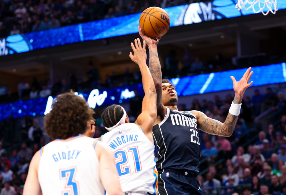 Feb 10, 2024; Dallas, Texas, USA; Dallas Mavericks forward P.J. Washington (25) shoots past Oklahoma City Thunder guard Aaron Wiggins (21) during the second half at American Airlines Center. Mandatory Credit: Kevin Jairaj-USA TODAY Sports