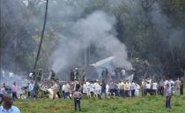 <p>Picture taken at the scene of the accident after a Cubana de Aviacion aircraft crashed after taking off from Havana’s Jose Marti airport on May 18, 2018. – A Cuban state airways passenger plane with 104 passengers on board crashed on shortly after taking off from Havana’s airport, state media reported. The Boeing 737 operated by Cubana de Aviacion crashed “near the international airport,” state agency Prensa Latina reported. Airport sources said the jetliner was heading from the capital to the eastern city of Holguin. (Photo: Adalberto Roque/AFP/Getty Images) </p>