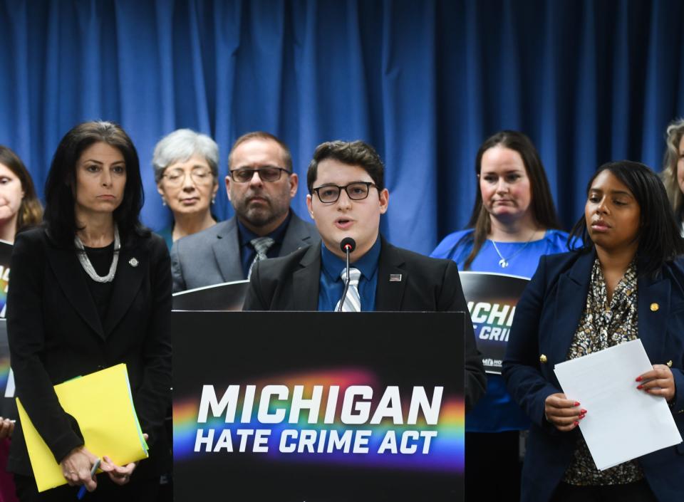 Rep. Noah Arbit, (D-West Bloomfield), speaks Wednesday, April 26, 2023, about hate crime reform, during a press conference in the Anderson House Office Building. Also pictured are Michigan Attorney General Dana Nessel, left, and Rep. Kristian Grant (D-Grand Rapids), right.