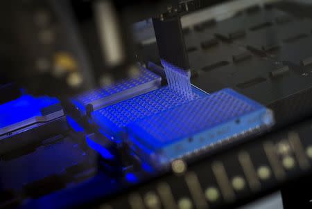 A robotic DNA sample automation machine works on DNA samples at a Regeneron Pharmaceuticals Inc. laboratory at the biotechnology company's headquarters in Tarrytown, New York March 24, 2015. REUTERS/Mike Segar