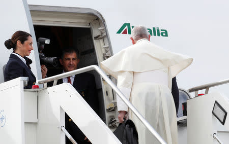 Pope Francis boards a plane before departure for his visit to United Arabs Emirates, at Leonardo da Vinci-Fiumicino Airport in Rome, Italy, February 3, 2019. REUTERS/Remo Casilli