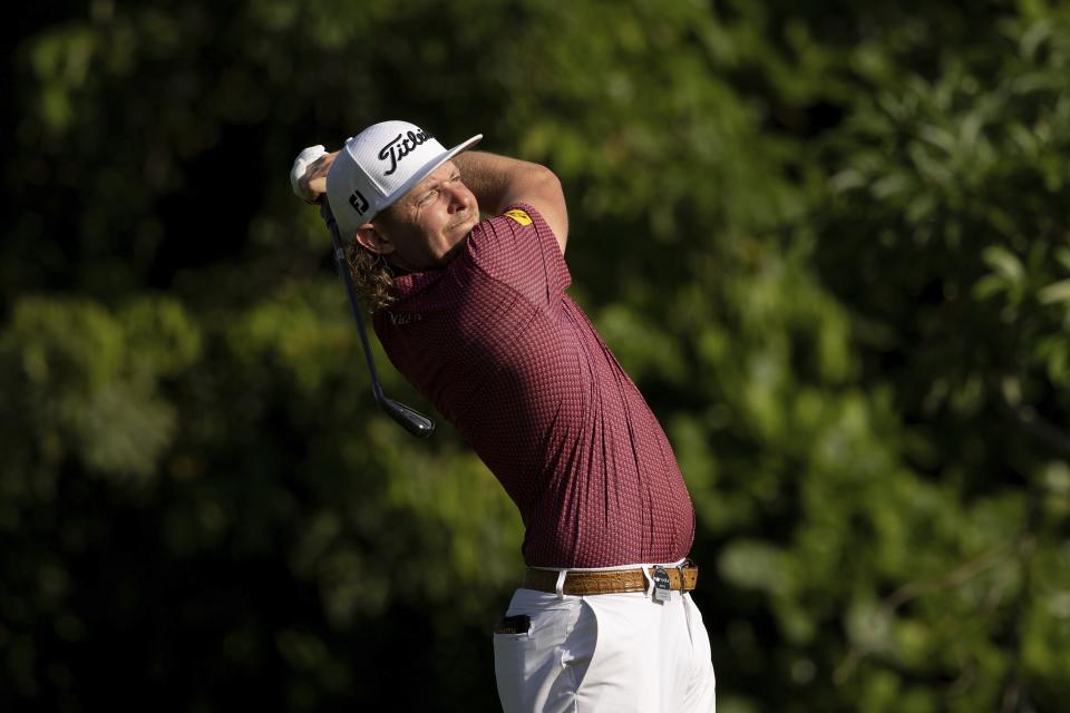 Cameron Smith plays his second shot on the third hole during the final round of LIV Golf Singapore at Sentosa Golf Club on Sunday, April 30, 2023, on Sentosa Island in Singapore. (Chris Trotman/LIV Golf via AP)