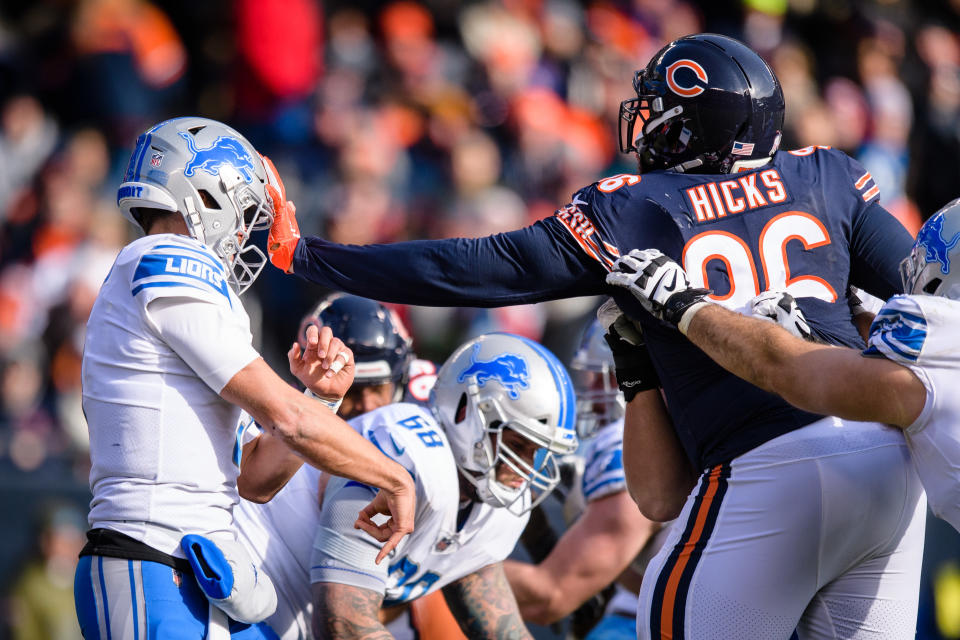 <p>Detroit Lions quarterback Matthew Stafford (9) is hit in the face by Chicago Bears defensive tackle Akiem Hicks (96) in the 2nd quarter during an NFL football game between the Detroit Lions and the Chicago Bears on November 11, 2018, at Soldier Field in Chicago, IL. (Photo by Daniel Bartel/Icon Sportswire) </p>