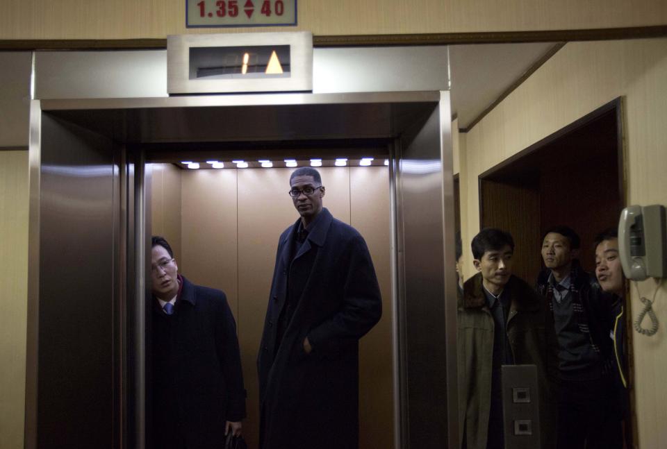 Former NBA basketball star Charles D. Smith enters an elevator at a hotel in Pyongyang, North Korea on Monday, Jan. 6, 2014. Dennis Rodman arrived in North Korea on Monday with a team of fellow former NBA players, including Smith, for an exhibition game on leader Kim Jong Un's birthday, after saying he wants to show that North Korea isn't so bad. (AP Photo/David Guttenfelder)