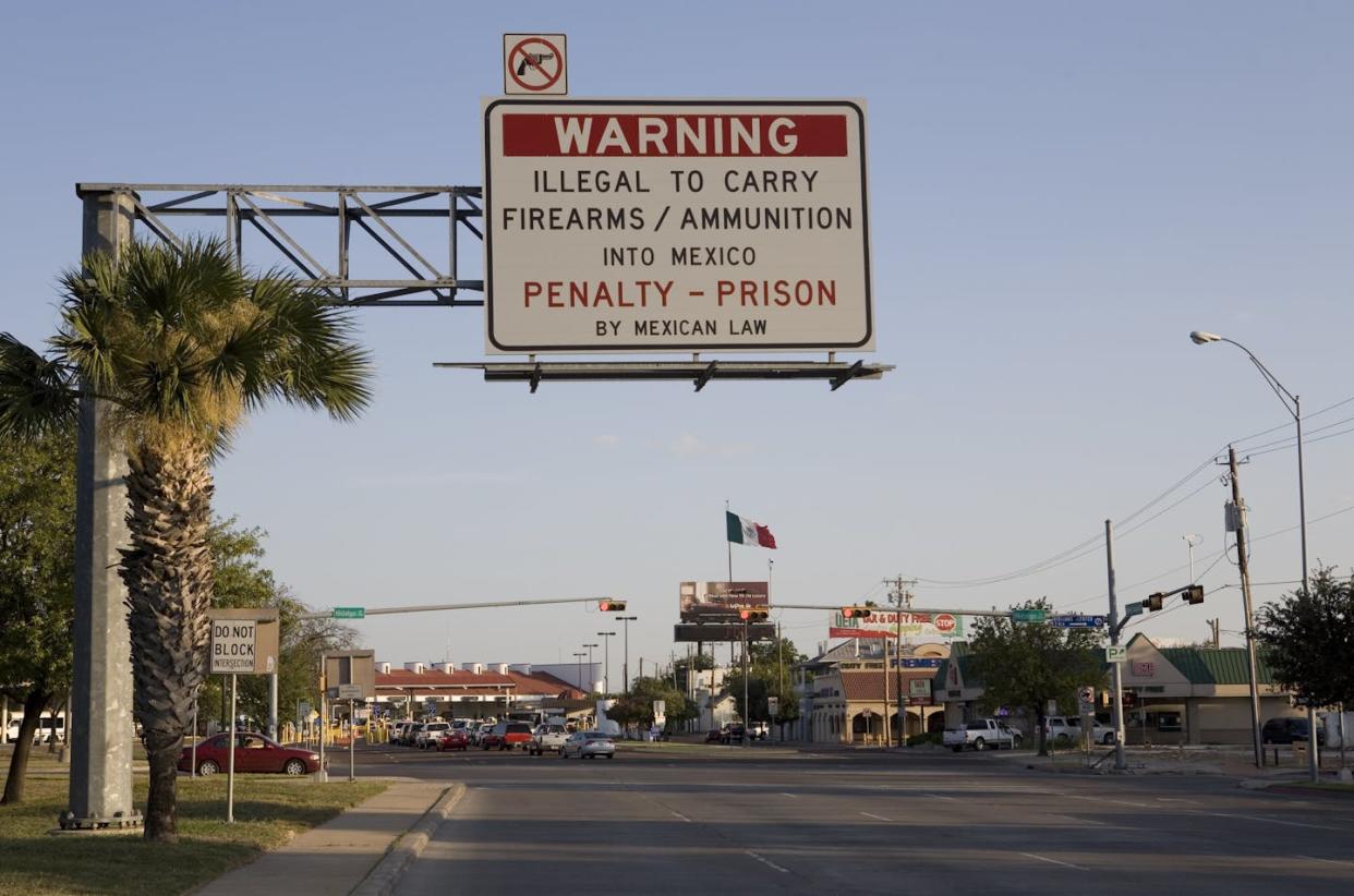 A sign in Laredo, Texas, reminds motorists not to smuggle guns into Mexico. <a href="https://www.gettyimages.com/detail/news-photo/sign-warns-motorists-not-to-smuggle-weapons-or-ammunitions-news-photo/91474155" rel="nofollow noopener" target="_blank" data-ylk="slk:Gilles Mingasson/Getty Images;elm:context_link;itc:0;sec:content-canvas" class="link ">Gilles Mingasson/Getty Images</a>