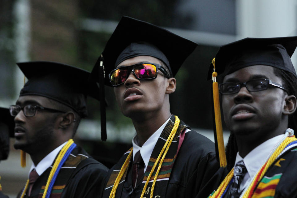 A member of the Morehouse College graduating class of 2013 wears sunglasses at the ceremony attended by U.S. President Barack Obama in Atlanta, Georgia, May 19, 2013.    REUTERS/Jason Reed    (UNITED STATES - Tags: POLITICS EDUCATION)