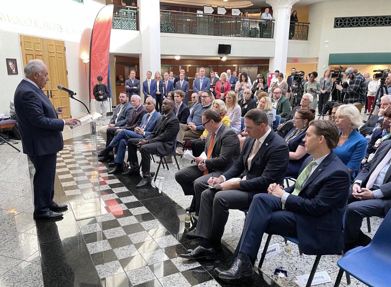 University of Florida board Chairman Mori Hosseini, at left, announces plans on Feb. 7, 2023 at Jacksonville City Hall of a partnership between the university and the city of Jacksonville for creating a UF graduate campus in the downtown area.