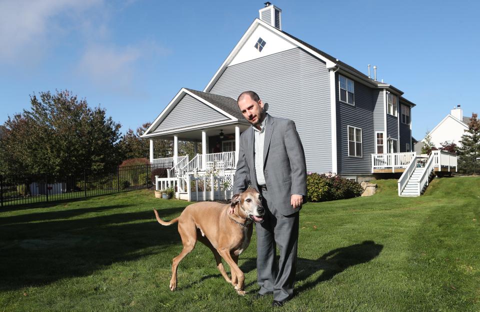 County legislature candidate Dan Branda plays with his his dog Phil outside his Somers home Oct. 19, 2023.