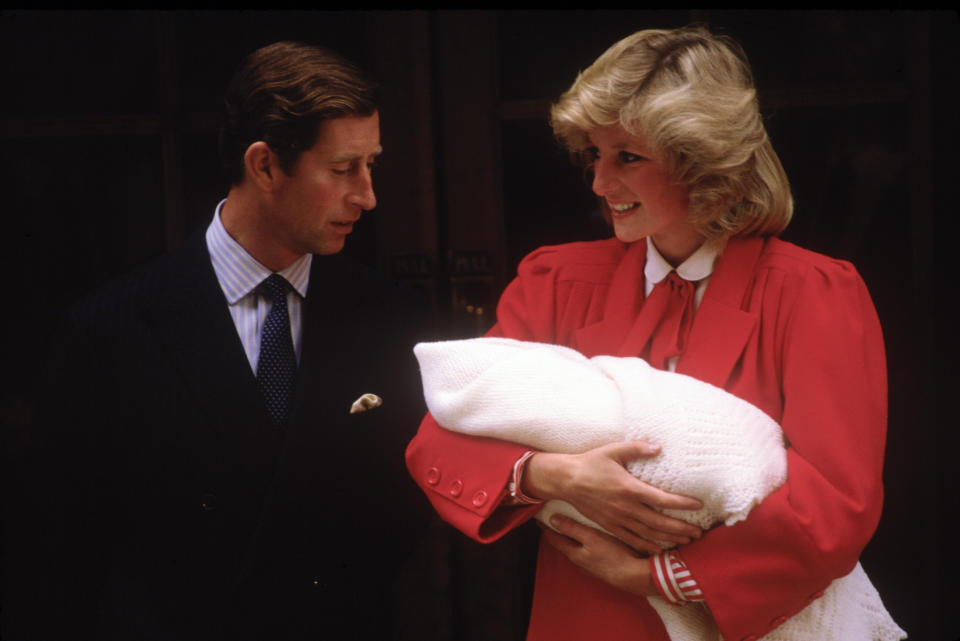 Princess Diana holds newborn Prince Harry as she and Prince Charles leave the Lindo Wing on Sept. 16, 1984. The couple went on to divorce in 1996, one year before Diana died in a car accident. 