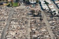 <p>In this aerial view, burned properties are seen in Santa Rosa, Calif., on Oct. 12, 2017. (Photo: Josh Edelson/AFP/Getty Images) </p>