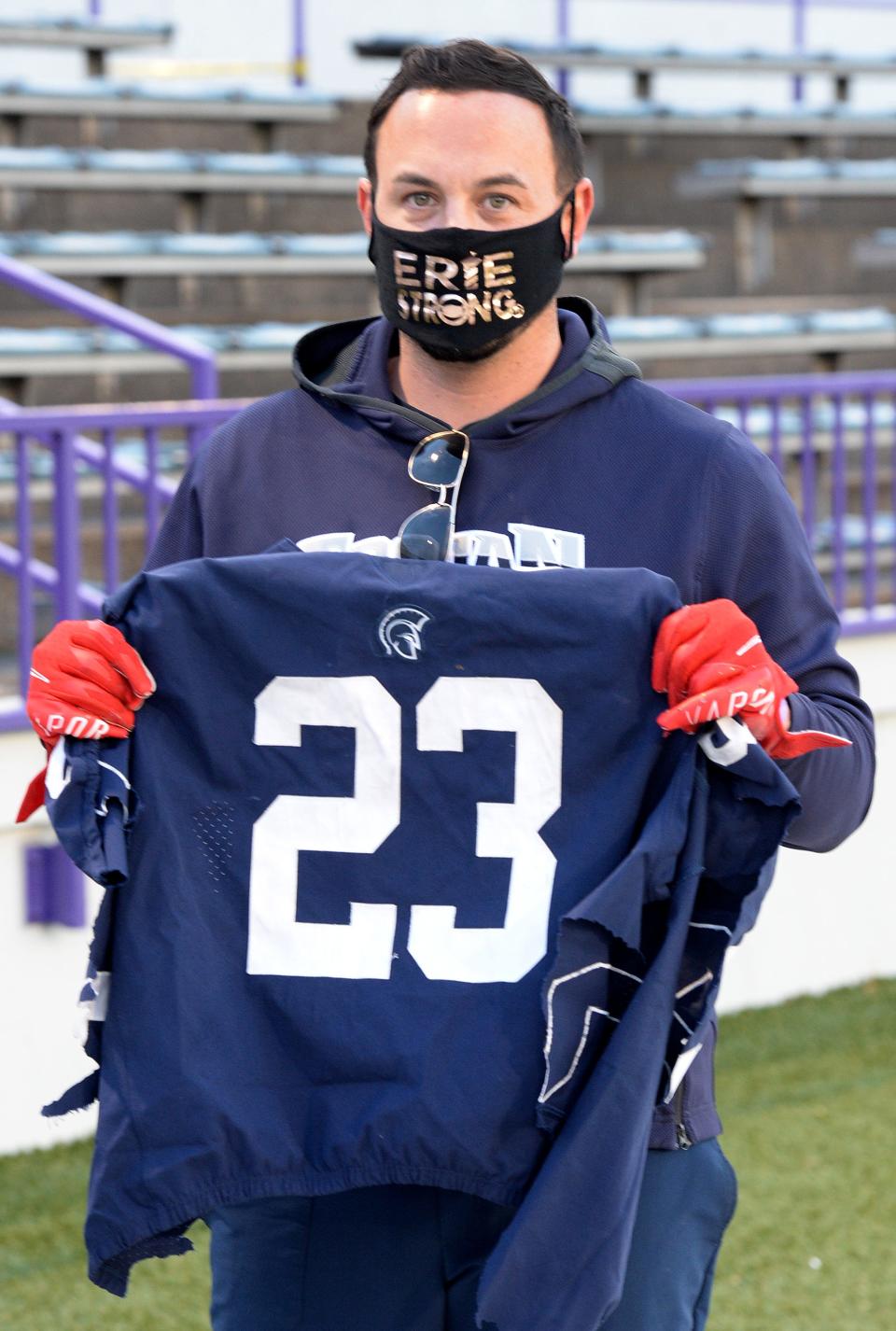 Brandon Beasley, the stepfather of former McDowell High School football player Jonathan Heubel, has supported Heubel throughout his legal ordeal. Beasley is shown on Oct. 23, 2020, at Erie Veterans Stadium before the McDowell vs. Erie High game. Heubel, who wore number 23, collapsed with a traumatic brain injury during a game against Cathedral Preparatory School about a week earlier.
