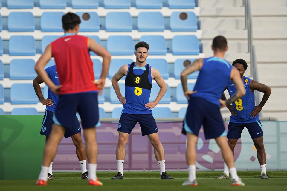 England's Declan Rice, middle, takes part in drills during an official training session at Al Wakrah Sports Complex, in Al Wakrah, Qatar, Thursday, Dec. 1, 2022. (AP Photo/Abbie Parr)