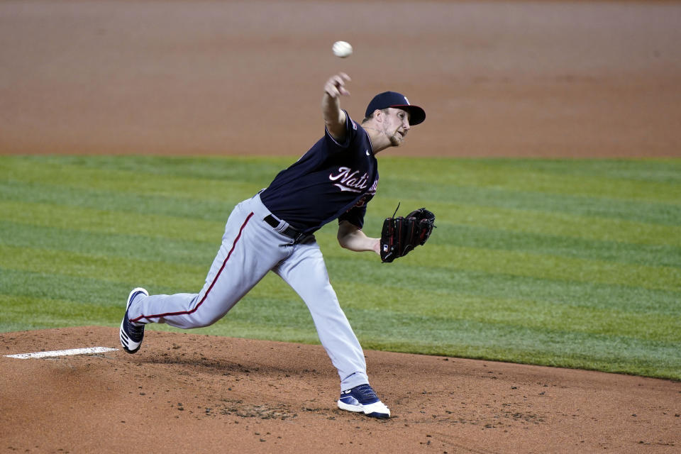 Washington Nationals' Erick Fedde pitches during the first inning of the first game of a baseball doubleheader against the Miami Marlins, Friday, Sept. 18, 2020, in Miami. (AP Photo/Wilfredo Lee)