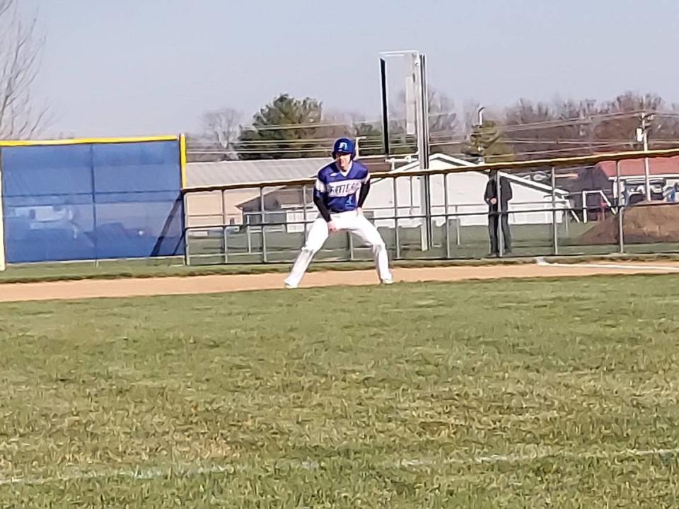 Freeburg second baseman Luke Isaacs leads off first base during a nonconference game against Highland on Monday, March 20, at Freeburg High School. The Midgets ultimately fell to the Bulldogs 8-4.