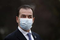 Romanian Prime Minister Ludovic Orban, walks on the Promenade Marie de Roumanie in Paris, Tuesday, Oct. 27, 2020. Orban is on a 2-day visit in Paris. (Benoit Tessier, Pool via AP)