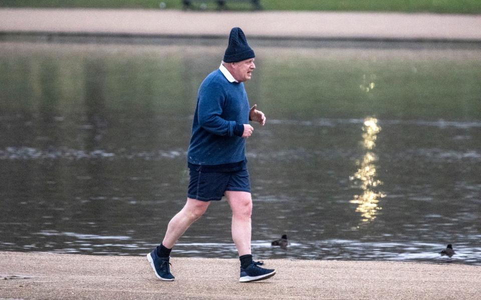 Boris Johnson, the former prime minister, is pictured going for a morning run in central London today - Jeremy Selwyn/SelwynPics