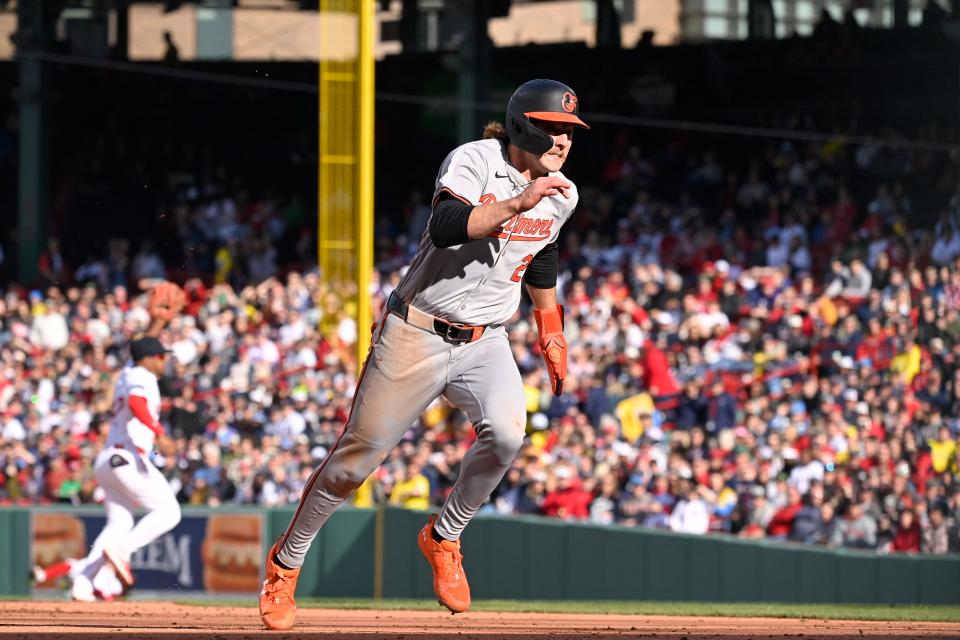 Orioles shortstop Gunnar Henderson runs to third base during the ninth inning at Fenway Park on Tuesday in the Red Sox's home opener. Baltimore won, 7-1.