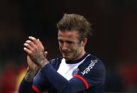 RNPS - PICTURES OF THE YEAR 2013 - Paris Saint-Germain's David Beckham breaks down in tears as he leaves the pitch after being substituted in the 81st minute during his team's French Ligue 1 soccer match against Brest at the Parc des Princes stadium in Paris May 18, 2013. REUTERS/Gonzalo Fuentes (FRANCE - Tags: SPORT SOCCER TPX)