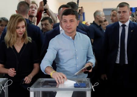 Ukraine's President Zelenskiy casts his ballot at a polling station during a parliamentary election in Kiev