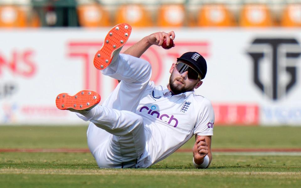 England's Gus Atkinson reacts after missing a catch opportunity during the fourth day of the first test cricket match between Pakistan and England, in Multan, Pakistan, Thursday, Oct. 10, 2024