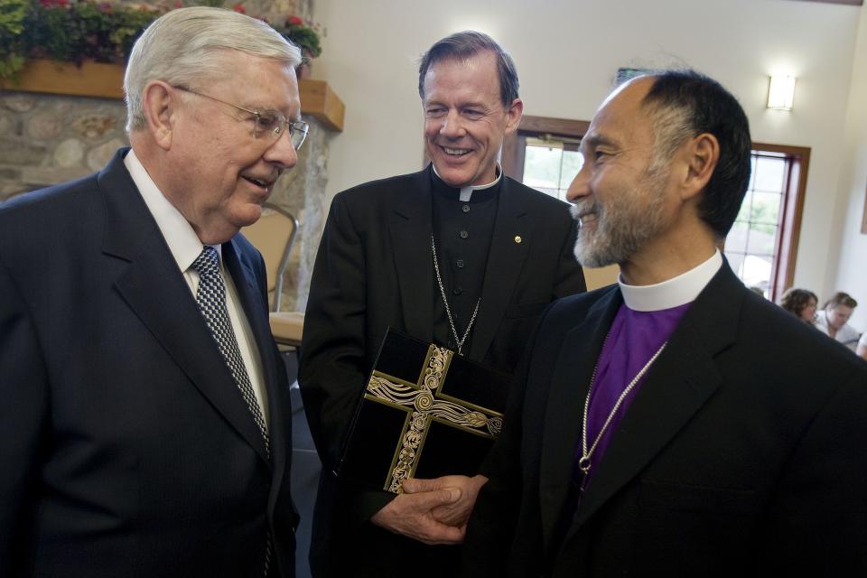 Elder M. Russell Ballard of the Quorum of the Twelve Apostles has a talk with The Most Reverend Bishop John C. Wester of the Catholic Diocese of Salt Lake City and Rev. Scott B. Hayashi of the Episcopal Church in Salt Lake City at the Garden Place and Walk of Pioneer Faiths Dedication at This Is The Place Park in Salt Lake City on June 29, 2011. | Deseret News, Mike Terry, Deseret News