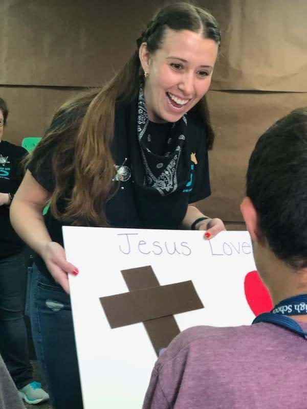 Volunteer Haley Woodall uses a story board to spread the message “Jesus loves you” at Forever His Bible Day Camp held at Karns Church of Christ Saturday, April 15, 2023.