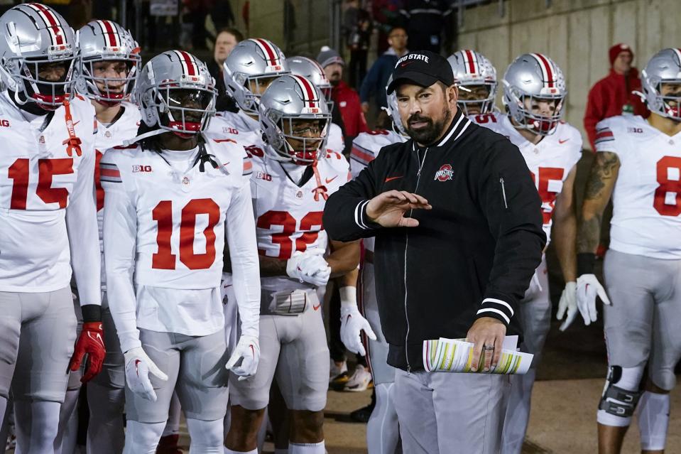 Ohio State head coach Ryan Day leads his team on the field before an NCAA college football game against Wisconsin Saturday, Oct. 28, 2023, in Madison, Wis. (AP Photo/Morry Gash)