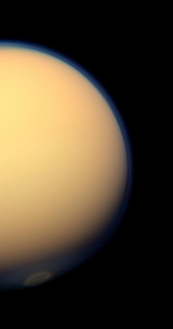 This day-side photo of Titan taken by the Cassini spacecraft shows a buildup of haze over the Saturn moon's south pole (bottom). Cassini has found a build up of haze over the south pole (bottom). New results from Cassini's infrared spectrometer