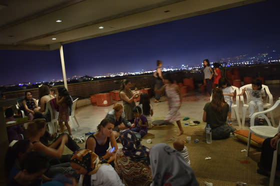 Refugee residents of the hotel organize a women-only dance party several nights a week on the rooftop terrace. It’s an opportunity for the women, many of them conservative Muslims from Syria, Iraq and Afghanistan, to relax, take off their headscarves and smoke hookah without worrying about prying male eyes.