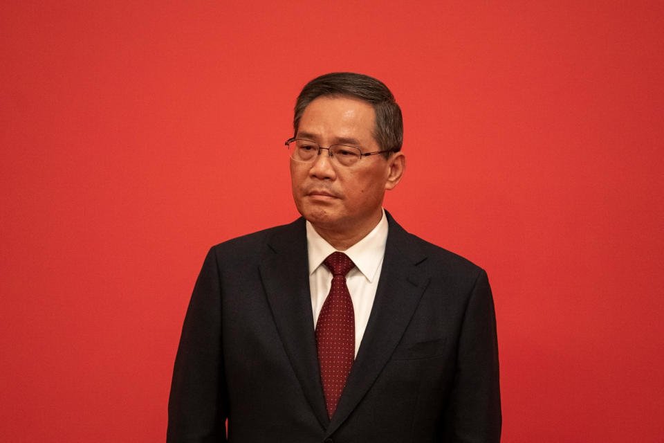 Li Qiang, member of the Communist Party of China's new Politburo Standing Committee, on stage during its unveiling at the Great Hall of the People in Beijing, China, on Sunday, Oct. 23, 2022. / Credit: Bloomberg