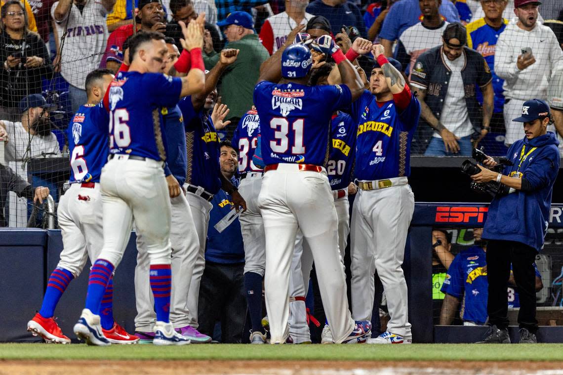 Venezuela players react with Yasiel Puig (31) and Ramon Flores (33) after the two scored runs during the fourth inning of a Caribbean Series Semi Final baseball game against Curacao at loanDepot park in Miami, Florida, on Thursday, February 8, 2024. D.A. Varela/dvarela@miamiherald.com