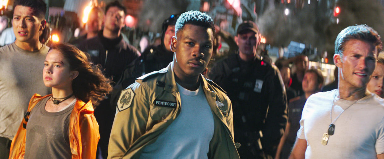 Cailee Spaeny, John Boyega, and Scott Eastwood in <em>Pacific Rim Uprising</em>. (Photo: Universal Pictures/courtesy Everett Collection)