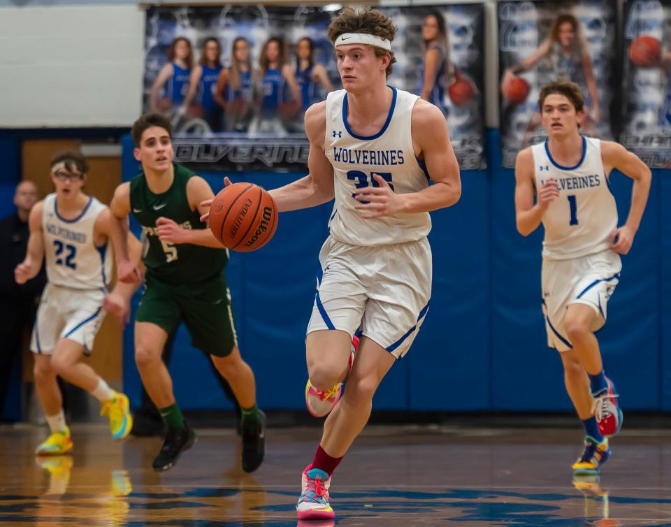 Ellwood City's Joseph Roth (35) heads down the court against Laurel with his older brother Alex (1) following him Tuesday at Lincoln High School.