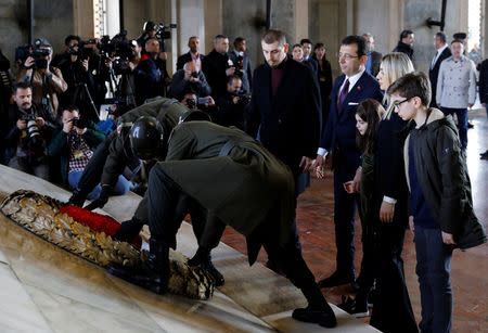 Ekrem Imamoglu, main opposition Republican People's Party (CHP) candidate for mayor of Istanbul, lays a wreath as he visits Anitkabir, the mausoleum of modern Turkey's founder Mustafa Kemal Ataturk, with his family in Ankara, Turkey, April 2, 2019. REUTERS/Umit Bektas