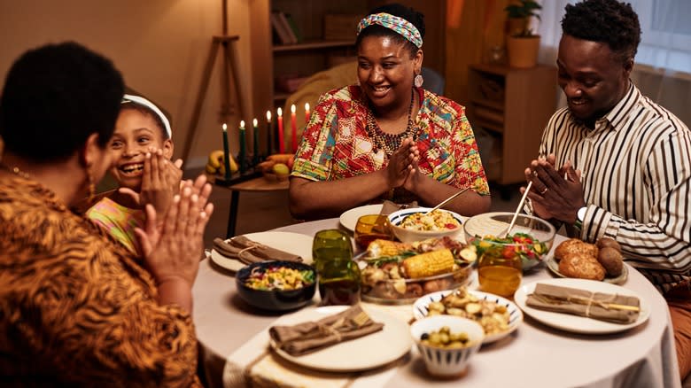 Happy family at Kwanzaa feast