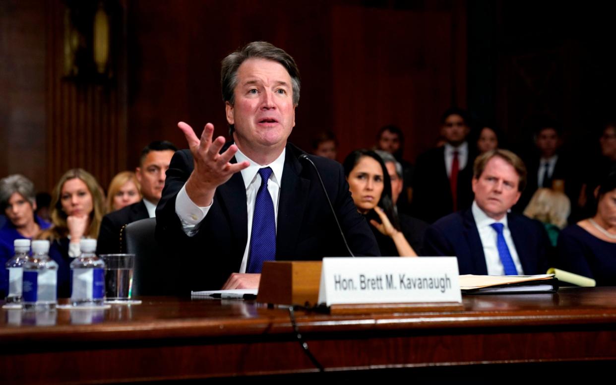 Brett Kavanaugh, the conservative Supreme Court justice, survived a tumultuous confirmation hearing last year - AFP