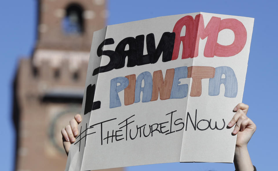 A student holds up a sign with writing reading in Italian "Lets save the planet", during a demonstration outside the Castello Sforzesco castle, in Milan, Italy, Friday, March 15, 2019. Students worldwide are skipping class Friday to take to the streets to protest their governments' failure to take sufficient action against global warming. (AP Photo/Luca Bruno)