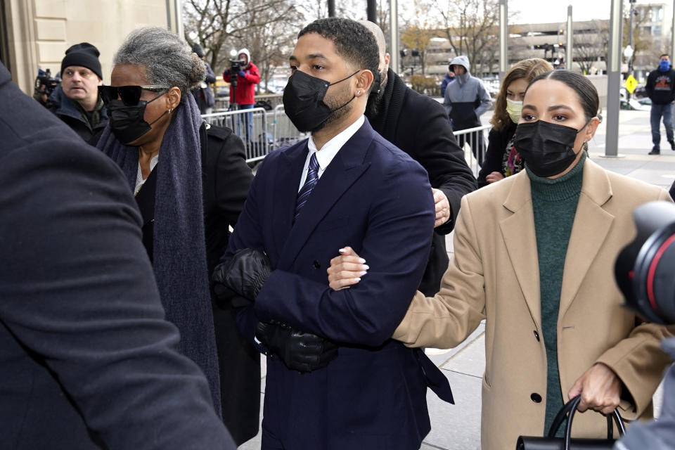 Actor Jussie Smollett walks with family members as they arrive Monday, Nov. 29, 2021, at the Leighton Criminal Courthouse for jury selection at his trial in Chicago. Smollett is accused of lying to police when he reported he was the victim of a racist, anti-gay attack in downtown Chicago nearly three years ago, in Chicago. (AP Photo/Charles Rex Arbogast)