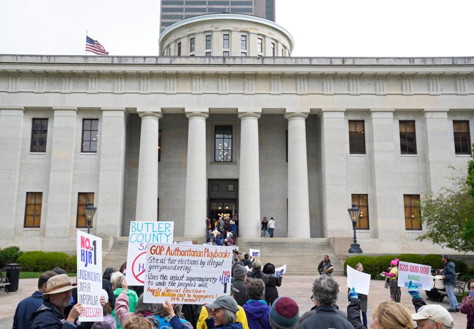 Demonstrators wait to enter the Ohio Statehouse on Wednesday to protest HJR 1/SJR 2, which would require a 60% vote to approve constitutional amendments.