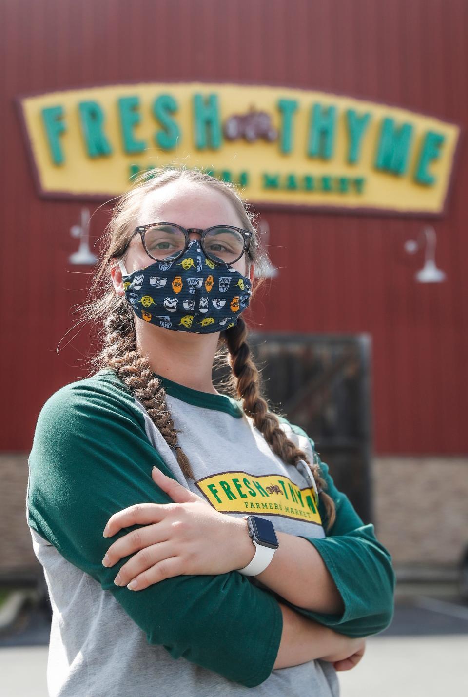 Four-month Fresh Thyme employee, Myra Carleton, poses for a photo outside of Fresh Thyme off of 86th St. in Indianapolis, Thursday, August 6, 2020.