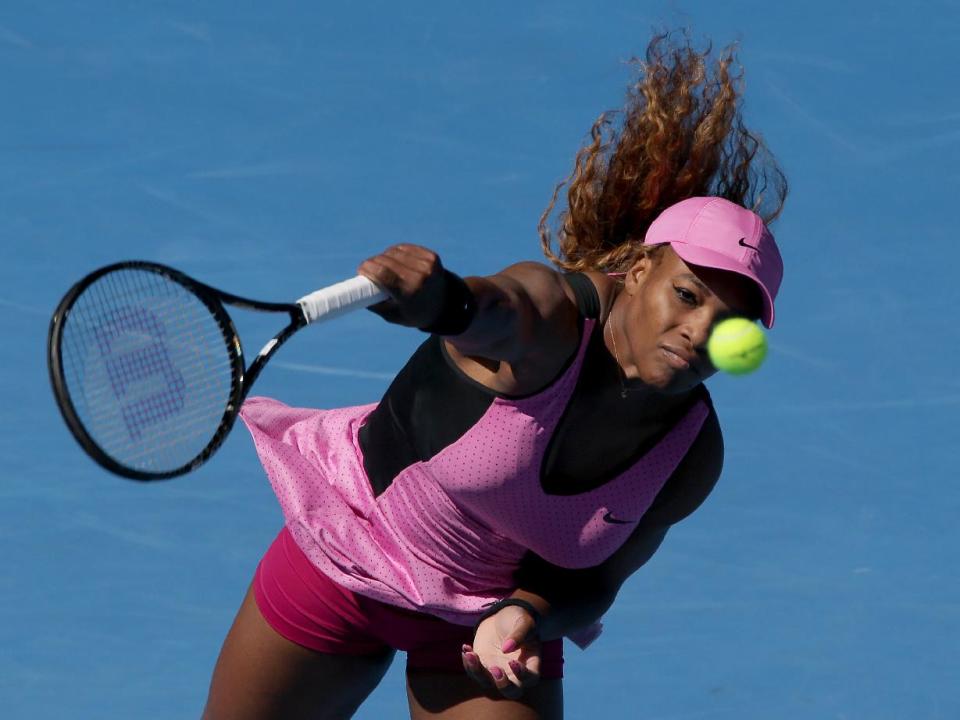 Serena Williams of the U.S. serves to Daniela Hantuchova of Slovakia during their third round match at the Australian Open tennis championship in Melbourne, Australia, Friday, Jan. 17, 2014.(AP Photo/Aaron Favila)