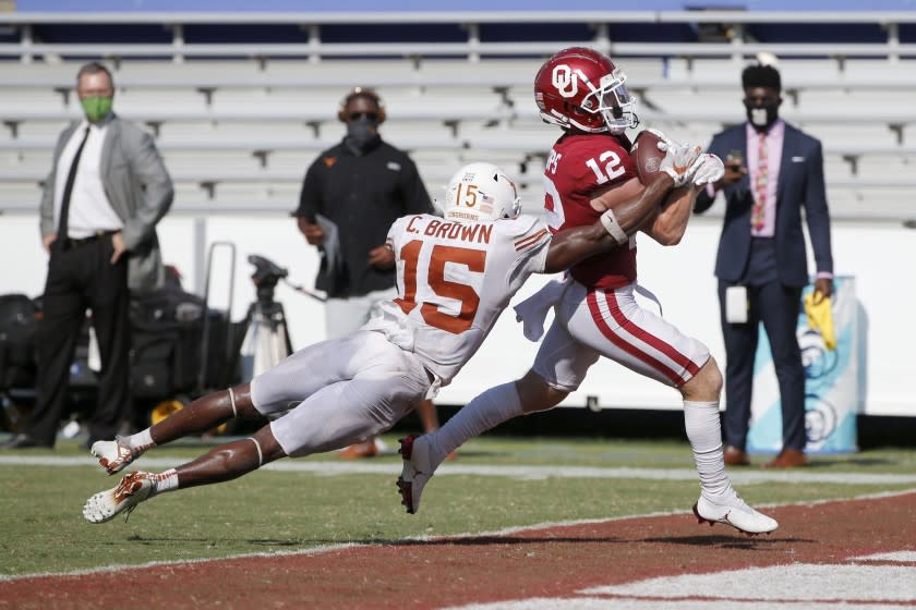 Oklahoma wide receiver Drake Stoops (12) scores the winning touchdown in overtime.