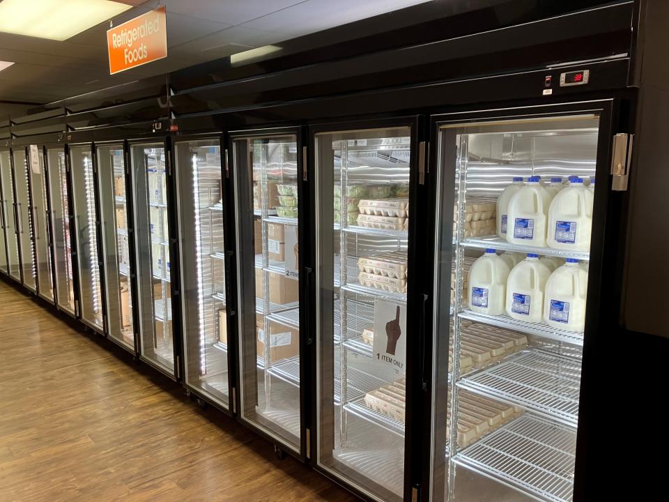 Coolers hold gallons of milk and other refrigerated items Tuesday at a new Food Pantry Network of Licking County market, 130 McMillen Drive, next to Licking Memorial Hospital in Newark.