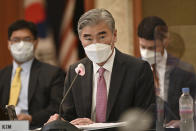 U.S. special representative for North Korea Sung Kim, center, speaks to South Korea's Special Representative for Korean Peninsula Peace and Security Affairs Noh Kyu-duk and Japanese Foreign Ministry's Director-General of the Asian and Oceanian Affairs Bureau Takehiro Funakoshi during their trilateral meeting at a hotel in Seoul Monday, June 21, 2021. (Jung Yeon-je/Pool Photo via AP)