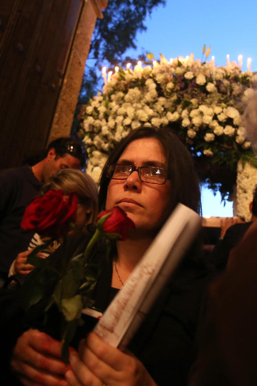 A Greek Orthodox Christian worshiper attends a Good Friday service at the church of Ayios Georgios Exorinos in Famagusta, Cyprus’ breakaway Turkish Cypriot north on Friday, April 18, 2014. It’s the first time in nearly 60 years that such a service during Christianity’s holiest week is being held at this 14th century church. Although the island’s conflict has never been about religion, the service is seen as an example of how faith can help mend the island’s ethnic division. (AP Photo/Philippos Christou)