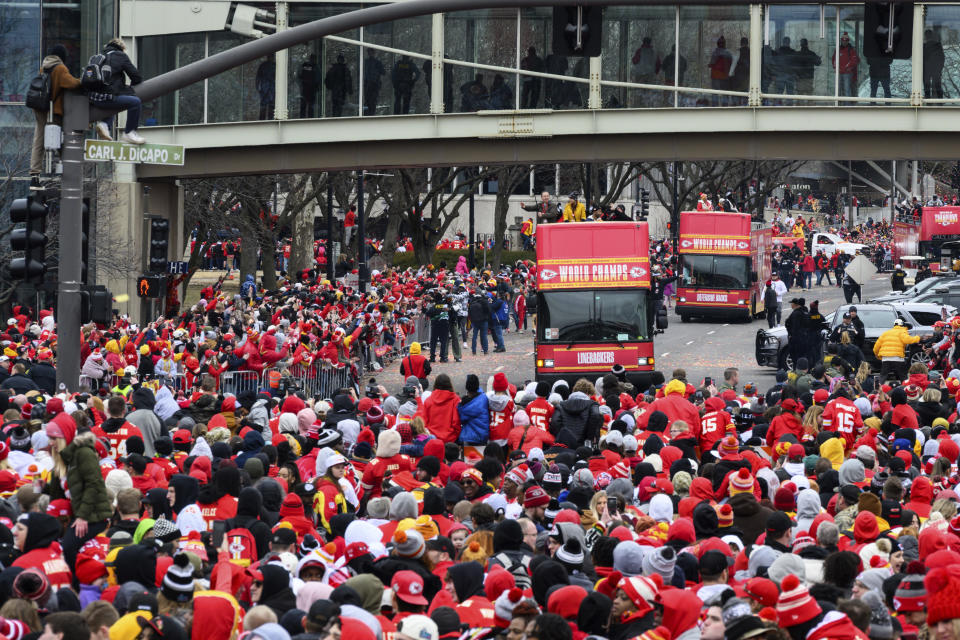 The Kansas City Chiefs' parade arrives for their victory rally in Kansas City, Mo., Wednesday, Feb. 15, 2023. The Chiefs defeated the Philadelphia Eagles in the NFL Super Bowl 57 football game. (AP Photo/Reed Hoffmann)