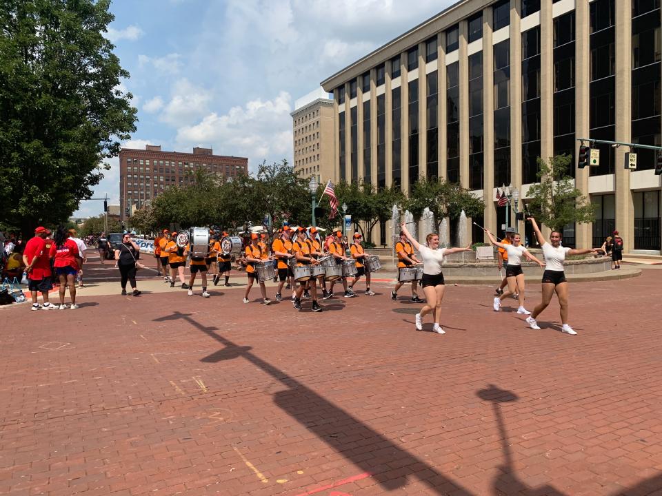 Members of the Massillon Tiger Swing Band perform Sunday at the Community Parade in downtown Canton. The event kicks off the annual Pro Football Hall of Fame Festival.