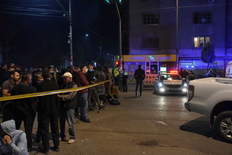 Policemen block the area after a gunman took hostages in a branch of the Bank of Georgia in Zugdidi