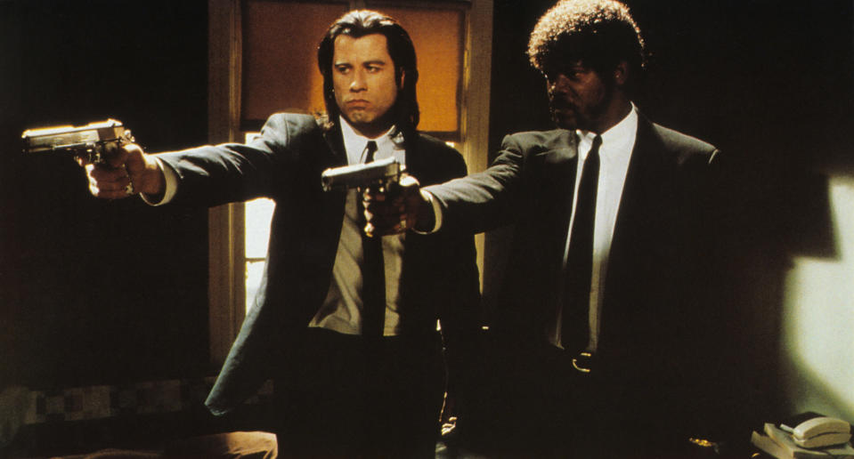 Samuel L. Jackson and John Travolta in the movie with their guns out